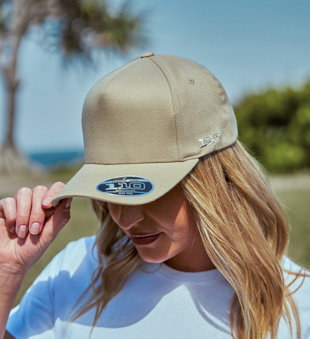 Woman wearing khaki 5-panel cap