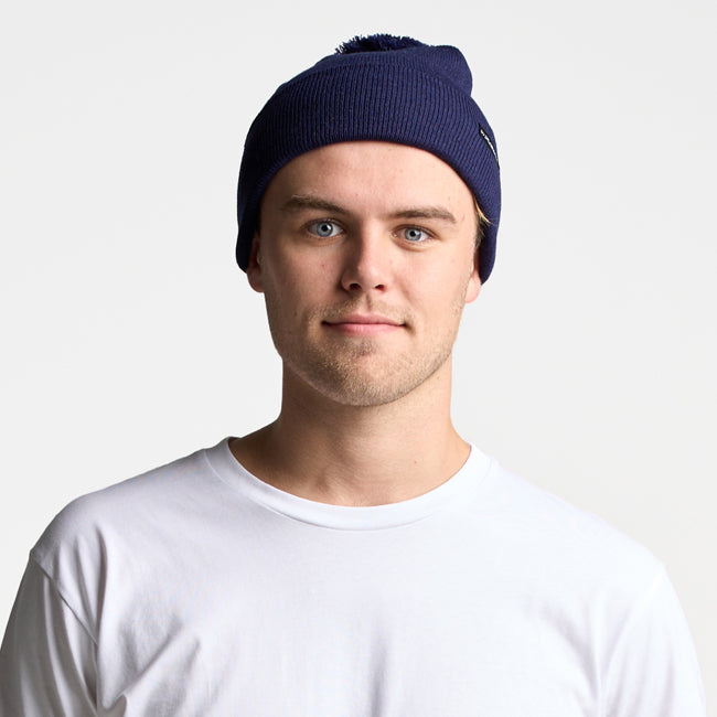 1501P POM POM BEANIE by FLEXFIT® | NAVY